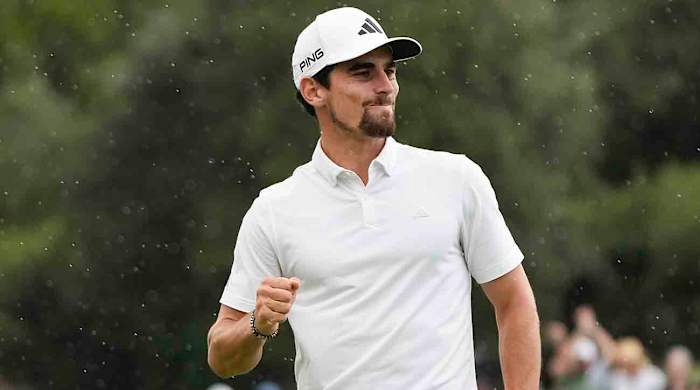 Chile's Joaquin Niemann reacts after winning the Australian Open Golf Championship on the second playoff hole against Japan's Rikuya Hoshino at the Australian Golf Club in Sydney, Australia, Sunday, Dec. 3, 2023.